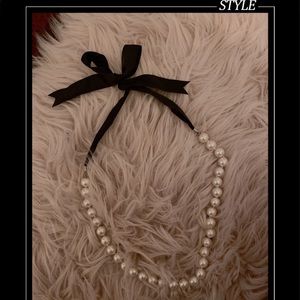 Faux pearls necklace with black ribbon